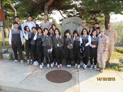 Marines give a tour of the base to Ocheon High School students who are
writing a story on Camp Mujuk for their school newspaper
