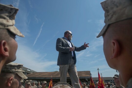 Retired Gunnery Sgt. Glen Silva gives a speech on the importance of Marines taking care of one another during a ceremony recognizing his leadership and service in the Corps, Aug. 28, 2015. Silva, formerly an infantry platoon sergeant, will have an award named after him awarded to staff-noncommissioned officers who are models of courage and performance within their field of expertise called the “GySgt. Glen Silva Staff NCO Award of Excellence.”