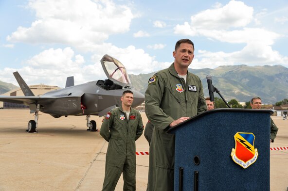 Col. David Lyons, 388th Fighter Wing commander, speaks to Airmen, civic leaders and media after delivering an operational F-35A Lightning II aircraft to Hill Air Force Base, Utah, Sept. 2, 2015. Lyons, along with Lt. Col. Yosef Morris, 34th Fighter Squadron director of operations, delivered the first two jets, known as AF-77 and AF-78, at approximately 1 p.m. MDT after a 90-minute flight from the F-35 production facility in Fort Worth, Texas. These aircraft are the first two of up to 72 jets that will be assigned to both the active-duty 388th and Reserve 419th Fighter Wings at Hill. (U.S. Air Force photo/Ron Bradshaw)