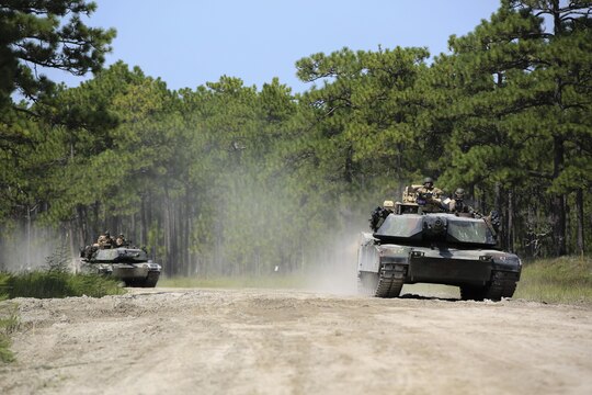 Marines with Alpha Company, 2nd Tank Battalion, make their way to Landing Zone Dodo to meet Marines with Golf Company, 2nd Battalion, 2nd Marine Regiment, during an integrated exercise at LZ Dodo, Camp Lejeune, N.C., Sept. 2, 2015. The exercise comes at a time when both battalions are making preparations for their Integrated Training Exercise at Marine Corps Air Ground Combat Center, Twentynine Palms, Calif., in the coming months. (U.S. Marine Corps photo by Cpl. Paul S. Martinez/Released)