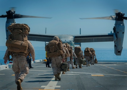 PACIFIC OCEAN (Sept. 5, 2015) – U.S. Marines assigned to 5th Marine Regiment Headquarters prepare to board an MV-22B Tilt-rotor Osprey assigned to Marine Medium Tilt-rotor Squadron (VMM) 163 with 3rd Marine Aircraft Wing during flight operations aboard amphibious transport dock ship USS Somerset (LPD 25) as part of Exercise Dawn Blitz 2015 (DB-15). Dawn Blitz 2015 is a scenario-driven exercise designed to train the U.S. Navy and Marine Corps in operations expected of an amphibious task force while also building U.S. and coalition operational interoperability. The exercise will test staffs in the planning and execution of amphibious operations in a series of live training events at sea and ashore. (U.S. Navy photo by Mass Communication Specialist 1st Class Vladimir Ramos/Released)