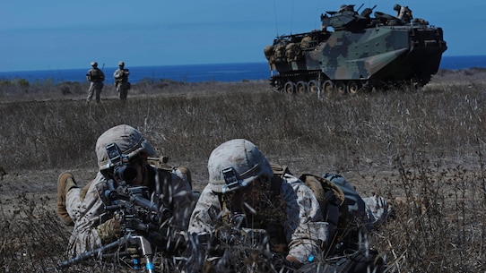 Marines with Alpha Company, 1st Battalion, 5th Marine Regiment provide security on the beach following an amphibious landing as part of Exercise Dawn Blitz 2015 at Marine Corps Base Camp Pendleton, Calif., Sept. 5, 2015. Dawn Blitz is a multinational, amphibious training exercise designed to hone the amphibious landing skills of I Marine Expeditionary Brigade, Expeditionary Strike Group Three and allies of the United States.