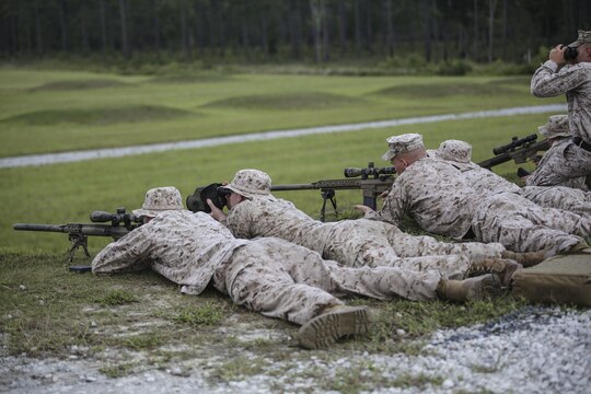 Marines with Sniper Platoon, Weapons Company, 2nd Battalion, 6th Marine Regiment, take aim on targets during a weapons zeroing range at G21, Camp Lejeune, N.C., Sept. 3, 2015. Shooters and spotters worked together to accurately engage targets. (U.S. Marine Corps photo by Cpl. Paul S. Martinez/Released)