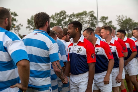 U.S. Marines with 1st Battalion, 4th Marine Regiment, Marine Rotational Force – Darwin, and members of the Darwin Stray Cats social rugby club shake hands before the start of the 9/11 memorial rugby match at the Defence Establishment Berrimah rugby field, Northern Territory, Australia Sept. 11. The annual match was established with the first game played between the 15th Marine Expeditionary Unit and the Stray Cats on Sept. 11, 2001, right before the terrorist attacks, and has become a commemorative match for each rotation of MRF-D. Participating in the match was an excellent opportunity to improve Marines’ knowledge of Australian culture and ultimately strengthened our bond as allies. (U.S. Marine Corps photo by Cpl. Reba James/ Released)