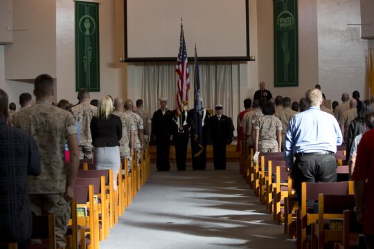 Station residents attend the 9/11 remembrance service at Marine Memorial Chapel aboard Marine Corps Air Station Iwakuni, Japan, Sept. 11, 2015. The service honored those who lost thier lives 14 years ago.