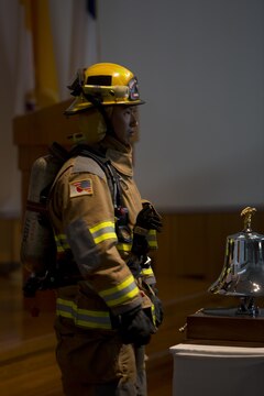 Station residents attend the 9/11 remembrance service at Marine Memorial Chapel aboard Marine Corps Air Station Iwakuni, Japan, Sept. 11, 2015. The service honored those who lost thier lives 14 years ago.