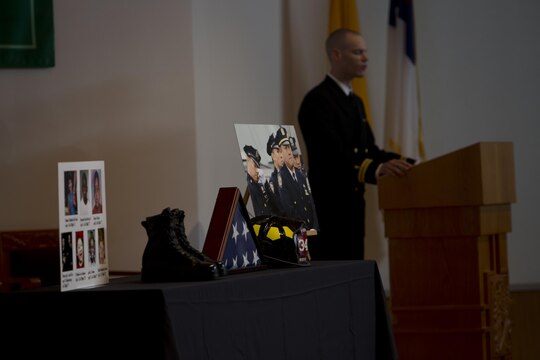 Station residents attend the 9/11 remembrance service at Marine Memorial Chapel aboard Marine Corps Air Station Iwakuni, Japan, Sept. 11, 2015. The service honored those who lost thier lives 14 years ago.