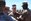 Assault Amphibian Vehicle Company Marines SSgt Matthew Walker and Cpl. Robert McCarthy pin rank insignia on newly promoted Cpl. Erick Moates Sept. 2 atop Mount Suribachi on Iwo Jima, Japan. AAV Company Marines are part of Task Force Iron Fist 4 out of Camp Fuji, Japan.