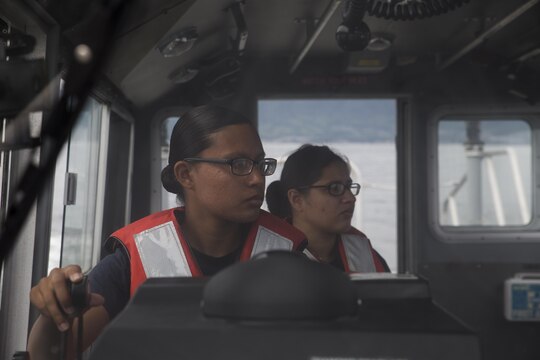 Seaman Apprentice Sol Mayra Zarco, a boatswain mate with Harbor Operations, practices walking the boat up to a buoy during a training evolution aboard Marine Corps Air Station Iwakuni, Japan, Sept. 2, 2015. Each trainee showed their ability to control the speed of the boat, check the current and make sure the waterway is clear of debris. These training events give harbor personnel ample experience and time to familiarize themselves with the boats so they will be ready when the need arises.(U.S. Marine Corps photo by Lance Cpl. Nicole Zurbrugg/Released)