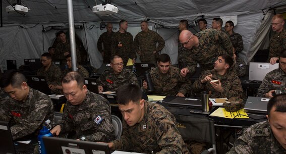 U.S. Marine Corps Lt. Gen. John Wissler, III Marine Expeditionary Force, commanding general, visits the Combat Operations Center on Camp Mujuk, Republic of Korea (ROK), March 20, 2015. CMCC CPX is held to strengthen closer staff coordination and combat readiness between U.S. and ROK forces. (U.S. Marine Corps photo by MCIPAC Combat Camera Pfc. Makenzie Fallon/Released)