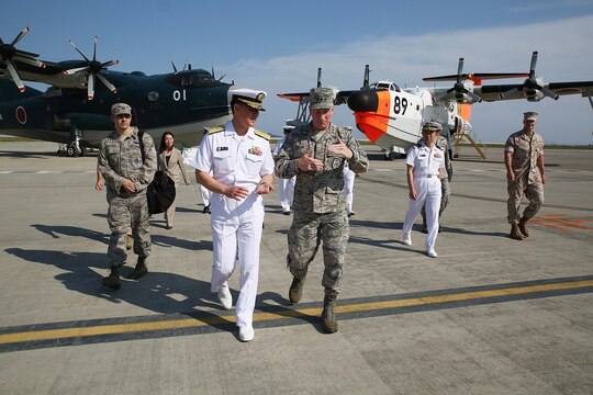 U.S. Air Force Lt. Gen. John L. Dolan, commander of U.S. Forces Japan and 5th Air Force, right, and Rear Adm. Naoki Sonoda, commander of Japan Maritime Self-Defense Force, Fleet Air Wing 31, left, say their goodbyes at the Japan Maritime Self-Defense Force hangar, Marine Corps Air Station Iwakuni, Japan, Sept. 29, 2015. Dolan set aside time during his brief stop at the station to reconnect with the JMSDF service members who rescued him after an aircraft collision almost two decades ago. Dolan ejected from his F-16, 630 nautical miles away from Tokyo into the Pacific Ocean, where he was saved almost five hours later by the Japanese aircraft rescue crew.