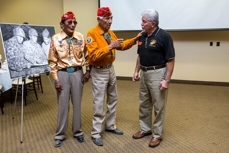 Navajo Code Talkers Samuel T. Holiday (left), and Roy Hawthorn (center), speak with Ray Lebron (right) during a tour of Camp Pendleton, Calif., Sept. 28, 2015.  The Navajo Code Talkers took part in every assault the U.S. Marines conducted in the Pacific from 1942 to 1945.  They served in all six Marine divisions, Marine Raider Battalions and Marine parachute units transmitting messages by telephone and radio in their native language that enemy forces were never able to break.  (U.S. Marine Corps photo by Lance Cpl. Adrianna R. Lincoln 1st Marine Division Combat Camera/Released)