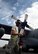 An Airman assigned to the 386th Expeditionary Logistics Readiness Squadron fuels management flight, returns a fuels hose after refueling a C-130H Hercules on the flightline at an undisclosed location in Southwest Asia, March 14, 2016. The fuels management flight maintains nearly two million gallons of fuel for all U.S. and coalition forces aircraft and vehicles deployed in support of Operation INHERENT RESOLVE. (U.S. Air Force photo by Staff Sgt. Jerilyn Quintanilla)