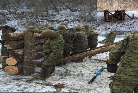 Marines from 3rd Platoon, Combat Engineer Company, Combat Assault Battalion, tie logs together with barbed wire to create obstacles Jan. 28 at Rodriguez Live Fire Complex, Republic of Korea. The Marines are from Combat Assault Battalion, 3rd Marine Division, III Marine Expeditionary Force, forward deployed in the Pacific. 