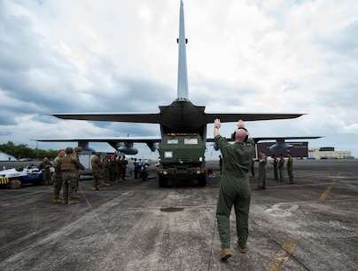 U.S. Marine Staff Sgt. Bill Fenton guides the members of Fox Platoon, 2nd Battalion, 14th Marine Regiment as they load a M142 High Mobility Rocket Artillery System onto a KC-130J Super Hercules during Balikatan 16 at Clark Air Base, Philippines, April 6, 2016. After loading the HIMARS, the aircraft and crew of Marine Aerial Refueler Transport Squadron 152, Marine Aircraft Group 12, 1st Marine Aircraft Wing flew the HIMARS for the first time in the Philippines. Balikatan 16 is an annual bilateral exercise which hones the combined U.S.-Philippine capability to respond to crises and conflict throughout the Indo-Asia-Pacific region.
