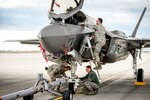 Aircraft maintainers, SSgt Thomas Stewart, left, Sr Airman Justin Wilmarth and SSgt Chris Mauldin, on ladder, prepare to tow an F-35A of the 31st Test and Evaluation Squadron, a tenant unit at Edwards Air Force Base, Calif., at Mountain Home AFB, Idaho, Feb 19, 2016. Six operational test and evaluation F-35s and more than 85 Airmen of the 31st TES travelled to Mountain Home AFB to conduct the first simulated deployment test of the F-35A, specifically to execute three key initial operational capability mission sets: suppression of enemy air defenses, close air support and air interdiction. Air Force photo by J.M. Eddins Jr.