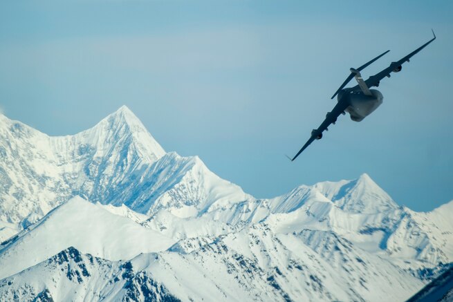 An Air Force C-17 Globemaster III aircraft conducts a low-level flight during Large Package Week at Joint Base Elmendorf-Richardson, Alaska, Apr. 5, 2016. Air Force photo by Senior Airman James Richardson