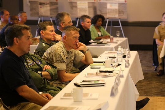 Senior leaders from the Naval Aviation Enterprise listen to a brief about Marine Aviation Logistics Squadron (MALS) 16 during the “Boots on the Ground” event aboard Marine Corps Air Station Miramar, Calif., April 5. “Boots on the Ground” allows senior leaders the opportunity to tour squadrons, meet with maintenance personnel and discuss how to better support aviation readiness requirements. (U.S. Marine Corps photo by Cpl. Alissa P. Schuning/Released)