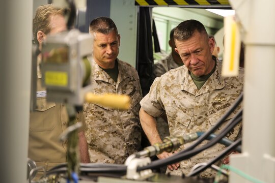 Lt. Gen. Jon Davis, deputy commandant for Marine Corps Aviation, observes a presentation by a Marine with Marine Aviation Logistics Squadron (MALS) 16 during the “Boots on the Ground” event aboard Marine Corps Air Station Miramar, Calif., April 5. “Boots on the Ground” allows senior leaders the opportunity to tour squadrons, meet with maintenance personnel and discuss how to better support aviation readiness requirements. (U.S. Marine Corps photo by Cpl. Alissa P. Schuning/Released)