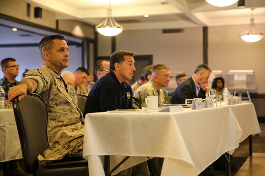 Maj. Gen. Michael Rocco, left, commanding general of 3rd Marine Aircraft Wing, and senior leaders from the Naval Aviation Enterprise and 3rd MAW listen to a brief about Marine Aviation Logistics Squadron (MALS) 16 during the “Boots on the Ground” event aboard Marine Corps Air Station Miramar, Calif., April 5. “Boots on the Ground” allows senior leaders the opportunity to tour squadrons, meet with maintenance personnel and discuss how to better support aviation readiness requirements. (U.S. Marine Corps photo by Cpl. Alissa P. Schuning/Released)