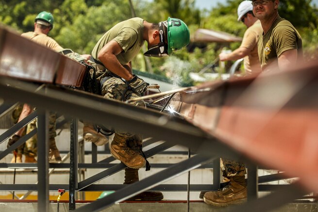 Marine Corps Lance Cpl. Marco Rodriguez welds and prepares metal framing at an elementary school during Exercise Balikatan 2016 in Capiz, Philippines, April 2, 2016. The effort is one of multiple community-assistance projects to improve the quality of life for residents and strengthen the bond between the U.S. and the Philippines. Rodriguez is assigned to the 9th Engineer Support Battalion. Marine Corps photo by Cpl. Hilda M. Becerra