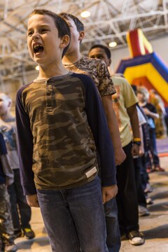 Andrew Carr sounds off during Junior Recruit Day at Marine Corps Air Station Iwakuni, Japan, April 8, 2016. Junior Recruit Day allowed the children of service member’s assigned Marine Aircraft Group 12 to get a first-hand look at what their military parents’ experiences on a daily basis. (U.S. Marine Corps photo by Sgt. Antonio J. Rubio)