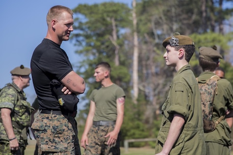 Staff Sgt. Chase Carson, a Martial Arts Instructor Trainer with Combat Logistics Battalion 6, 2nd Marine Logistics Group, answers questions from a Canadian cadet following a Marine Corps Martial Arts Program demonstration at Camp Lejeune, N.C., March 16, 2016. A total of 46 cadets with the Argyll and Sutherland Highlanders of Canada Regimental Cadet Corps visited the base and multiple units as part of an educational tour to better understand how foreign militaries function. 
