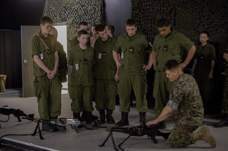 Lance Cpl. Nicholas Rautio, a machinegun instructor at the Battle Skills Training School, operated by the 2nd Marine Logistics Group, talks to Canadian cadets about the purpose of the M240B medium machinegun at Camp Lejeune, N.C., March 15, 2016. A total of 46 cadets with the Argyll and Sutherland Highlanders of Canada Regimental Cadet Corps visited the base and multiple units as part of an educational tour to better understand of how foreign militaries function. (U.S. Marine Corps photo by Lance Cpl. Preston McDonald/Released)