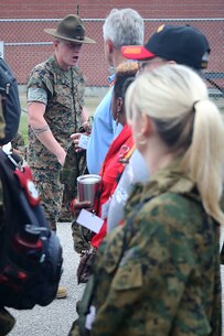 Sgt. Marcin Rejment, drill instructor with 1st Battalion, instructs educators from the greater Montgomery area on how to properly be in a formation aboard Marine Corps Recruit Depot Parris Island, S.C., April 13, 2016. The teachers, coaches, and principals of Recruiting Stations Jacksonville and Montgomery participate in a three-day workshop designed to inform educators about military service and life in the Marine Corps. (Official Marine Corps photo Cpl. John-Paul Imbody)