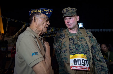 His Excellency Fidel V. Ramos, former president of the Republic of the Philippines, talks with U.S. Marine Col. J.C. Lewis, commanding officer 12th Marine Regiment, 3rd Marine Division, III Marine Expeditionary Force before the Capas Freedom March during Balikatan 16 at Capas, Philippines, April 11, 2016. U.S. and Philippine service members participated in the 2nd annual Capas Freedom March with the theme "March for a Veteran” where each participant marched to honor a veteran of their choice. Balikatan is an annual Philippine-U.S. military bilateral training exercise that is a signature element of the Philippine-U.S. alliance focused on a variety of missions to include humanitarian assistance maritime law enforcement, and environment protection. 
