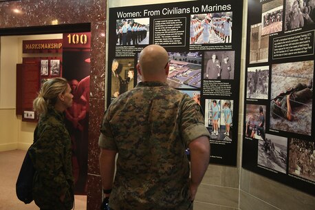 Staff Sgt. Robert Etzler, recruiter from Recruiting Substation Dothan, and Missy Bossardet, discuss with each other how women have impacted the Marine Corps in the Parris Island Museum aboard Marine Corps Recruit Depot Parris Island, S.C., April 14, 2016. The teachers, coaches, and principals of Recruiting Stations Jacksonville and Montgomery participate in a three-day workshop designed to inform educators about military service and life in the Marine Corps. (Official Marine Corps photo Cpl. John-Paul Imbody)