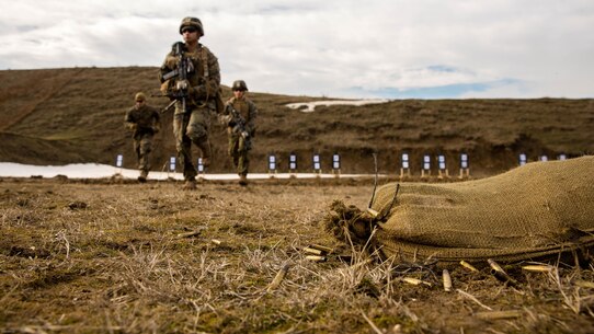 U.S. Marines with Black Sea Rotational Force move to the 100 yard line to shoot their conformation group during a live-fire exercise aboard Mihail Kognalniceanu Air Base, Romania, Feb. 2, 2016. Marines from 1st Battalion, 8th Marine Regiment, conducted battle sight zeroes on various individual weapons systems, to prepare for future BSRF exercises and contingencies. 