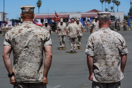 MARINE CORPS BASE, CAMP PENDLETON,Calif. – Col. Vance L. Cryer (left) the out-going commanding officer for the 15th Marine Expeditionary Unit, and Col. James P. Fallon, the unit’s oncoming commanding officer, stand ready to salute Marines during a pass in review during a change of command ceremony on Camp Pendleton April 22, 2016. During the ceremony Cryer relinquished command of the unit to Fallon who previously was the MEU’s executive officer. (Marine Corps photo by Cpl. Jonathan Boynes/Released)