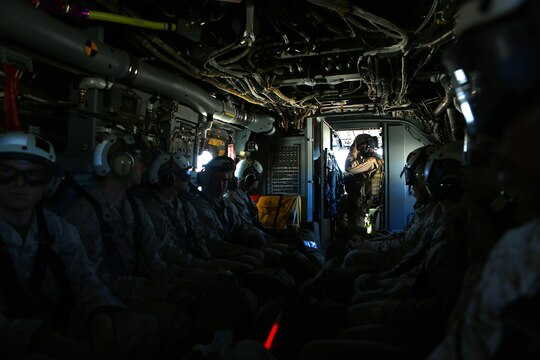 Marines with Headquarters and Headquarters Squadron, Marine Corps Air Station Camp Pendleton fly on an MV-22 Osprey to Red Beach, Camp Pendleton to start Warrior Night, April 22, 2016. The Warrior Night is a way for Marines in a unit to come together and enjoy each other’s company to harden camaraderie and espirit de corps. (Marine Corps Photo by Lance Cpl. Emmanuel Necoechea)