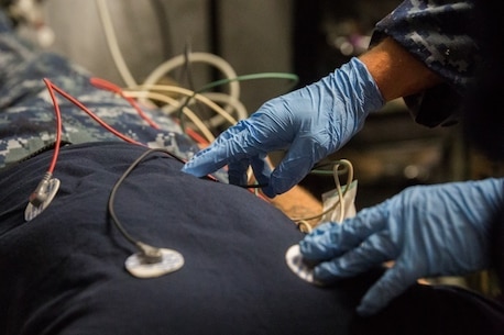 A sailor with 2nd Medical Battalion applies electrodes to monitor a patient’s vitals during Health Service Augmentation Program training at Camp Lejeune, N.C., April 20, 2016. HSAP training, a week long exercise, trains medical personnel the basics of a shock trauma platoon and how it operates in a deployed environment.