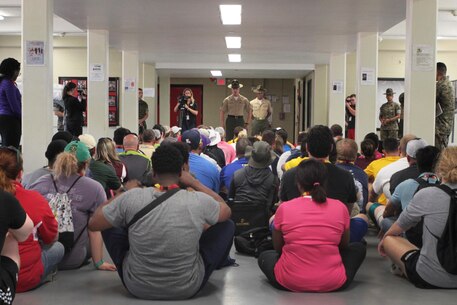 Educators of the greater Nashville and Baton Rouge areas ask Staff Sgt. Michael Light, senior drill instructor of 1st Recruit Training Battalion, questions about recruit training aboard Marine Corps Recruit Depot Parris Island, S.C., April 27, 2016. The teachers, coaches, and principals of Recruiting Stations Nashville and Baton Rouge participate in a three-day workshop designed to inform educators about military service and life in the Marine Corps. (Official Marine Corps photo Cpl. Diamond N. Peden)