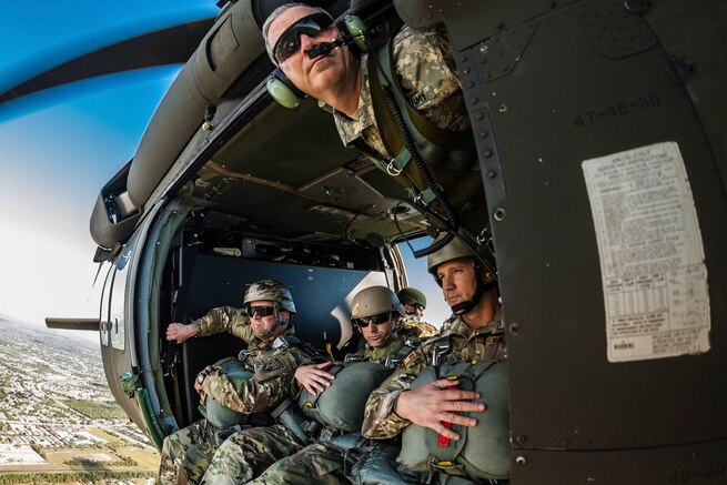 Soldiers conduct airborne operations from a UH-60 Black Hawk helicopter piloted by a Florida National Guard helicopter crew over Brooksville, Fla., April 23, 2016. The soldiers are assigned to U.S. Special Operations Command. Army photo by Ching Oettel
