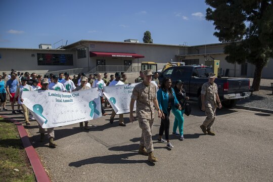 Col. Jason Woodworth, left, commanding officer of Marine Corps Air Station Miramar, and Sgt. Maj. Michael Walton, MCAS Miramar sergeant major, lead the 2016 Sexual Assault Prevention and Response Walk aboard MCAS Miramar, Calif., April 22. The walk promoted awareness on sexual assault and how to stop it. (U.S. Marine Corps photo by Sgt. Michael Thorn/Released)