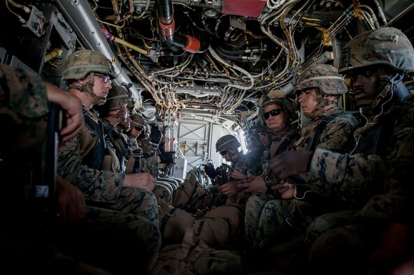 U.S. Marines assigned to Golf Company, 2nd Battalion, 2nd Marines Regiment, Marine Corps Base Camp Lejeune, N.C. transit on an MV-22 Osprey assigned to Marine Medium Tiltrotor Squadron 265, Marine Corps Air Station Futenma, Japan, during a long-range airfield seizure exercise July 20, 2016, over the Pacific Ocean. With logistics and refueling support from the U.S. Air Force 353rd Special Operations Group assigned to Kadena Air Base, Japan, the Marines extended their range of assault force beyond the Osprey’s built-in range of 500 nautical miles. (U.S. Air Force Photo by Senior Airman Peter Reft) 