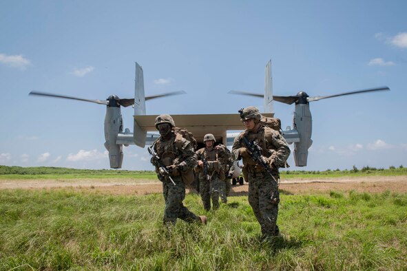 A U.S. Marine Corps MV-22 Osprey assigned to Marine Medium Tiltrotor Squadron 265, Marine Corps Air Station Futenma, Japan, drops off Marines assigned to Golf Company, 2nd Battalion, 2nd Marine Regiment, Marine Corps Base Camp Lejeune, N.C., during a long-range airfield seizure exercise July 20, 2016, at Iejima airfield, Japan. The Osprey can carry 24 combat troops, transport them with the speed and range of a fixed wing aircraft, and perform insertions or extractions with the maneuverability of rotor aircraft. (U.S. Air Force Photo by Senior Airman Peter Reft) 