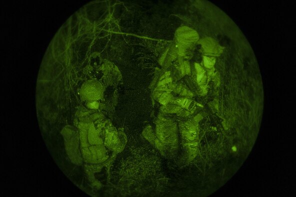 Deployed aircraft ground response element (DAGRE) Airmen, assigned to the 353rd Special Operations Support Squadron, walk through the woods to get to an objective during an exercise at Kadena Air Base, Japan, July 27, 2016. The DAGRE Airmen trekked through the woods to rescue an important person and brought them safely back to the extraction point. (U.S. Air Force photo by Airman 1st Class Corey M. Pettis)