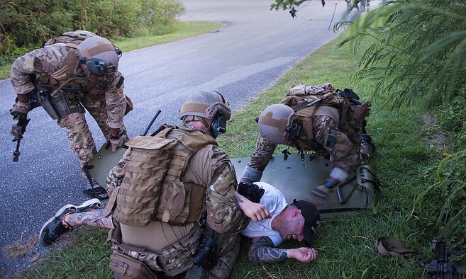 Deployed aircraft ground response element (DAGRE) Airmen, assigned to the 353rd Special Operations Support Squadron, perform simulated first aid during an exercise at Kadena Air Base, Japan, July 27, 2016. The DAGRE team participated in a humanitarian assistance/disaster relief exercise. (U.S. Air Force photo by Airman 1st Class Corey M. Pettis) 
