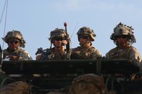 Marines with 3rd Battalion, 1st Marine Regiment, 1st Marine Division scan the horizon from an amphibious assault vehicle during amphibious assault training on Marine Corps Base Camp Pendleton, California, August 2, 2016. The Marines conducted the training during a Marine Corps Combat Readiness Evaluation to prepare for a future deployment. 