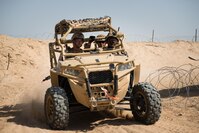 Marines with Kilo company, 3rd Battalion, 5th Marine Regiment, rush to provide support for other Marines in a MRZR at Marine Corps Air Ground Combat Center Twentynine Palms, Calif., July 31, 2016. The system was built by the Marine Corps Warfighting Laboratory (MCWL), which to assist Marines. The lab is conducting a Marine Air-Ground Task Force Integrated Experiment (MIX-16) in conjunction with Rim of the Pacific (RIMPAC-16) to explore new gear and assess its capabilities for potential future use. MCWL identifies possible challenges of the future, develops new warfighting concepts, and tests new ideas to help develop equipment that meets the challenges of the future operating environment. 