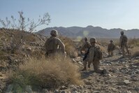 Marine Corps Air Ground Combat Center at Twentynine Palms, California – Marines with Kilo Company, 3rd Battalion, 5th Marine Regiment run through a scenario during the Marine Air Ground Task Force Integrated Experiment (MIX-16) August 5, 2016 at the Marine Corps Air Ground Combat Center at Twentynine Palms, California. MIX-16 is being used to test new equipment and concepts to help the Marine Corps meet the challenges of the future operating environment. MIX-16 is the first event in the Sea Dragon 2025 initiative, which is the Marine Corps’ deliberate campaign to blend innovative ideas and concepts through war gaming and experimentation to refine the force of the future.
