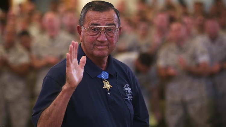 Col. Jay R. Vargas, a Congressional Medal of Honor recipient, waves at the camera after speaking to service members about the importance of finding help for those suffering from post-traumatic stress disorder May 12, 2015, at the Chaplain Joseph W. Estabrook Chapel aboard Marine Corps Base Hawaii. 