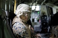 A U.S. Marine assigned to Logistics Operations School, Marine Corps Combat Service Support Schools, looks out from the rear opening of a CH-53E Super Stallion before conducting a Helicopter Support Team exercise at Marine Corps Base Camp Lejeune, N.C., July 19, 2016. Students attending LOS performed HST exercises as part of their required entry-level training. 