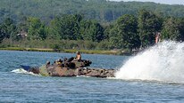 Marines from  Company C, 4th Reconnaissance Battalion, 4th Marine Division rehearse amphibious assault operations on Lake Margrethe in Camp Grayling, Michigan, during exercise Northern Strike 16, while boats from the Michigan National Guard, Sault Ste. Marie-based 1437th Engineers, secure the training area on Aug. 11, 2016.  The amphibious training being conducted on the lake marks a first for Camp Grayling and the Michigan National Guard.  
