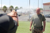 U.S. Marine Corps Lance Cpl. Gregory Gostomski a combat engineer with Special Purpose Marine Air-Ground Task Force Crisis Response-Africa, is sprayed with OC spray during a non-lethal course at Naval Air Station Sigonella, Italy, Aug. 4, 2016. Marines were taught show-of-force tactics, how to restrain a non-combative individual and experienced OC spray and the X-26E TASER during the course. 