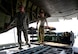Senior Master Sgt. Lesley Blue, 746th Expeditionary Airlift Squadron first sergeant, and 1st Lt. Justin Stein, 379th Expeditionary Aeromedical Evacuation Squadron medical crew director, load a frequency converter onto a C-130 Hercules July 28, 2016, at Al Udeid Air Base, Qatar. A frequency converter is used to convert the air conditioning power to household grade power so that in-flight equipment can be charged and used during the mission. (U.S. Air Force photo/Senior Airman Janelle Patiño/Released)